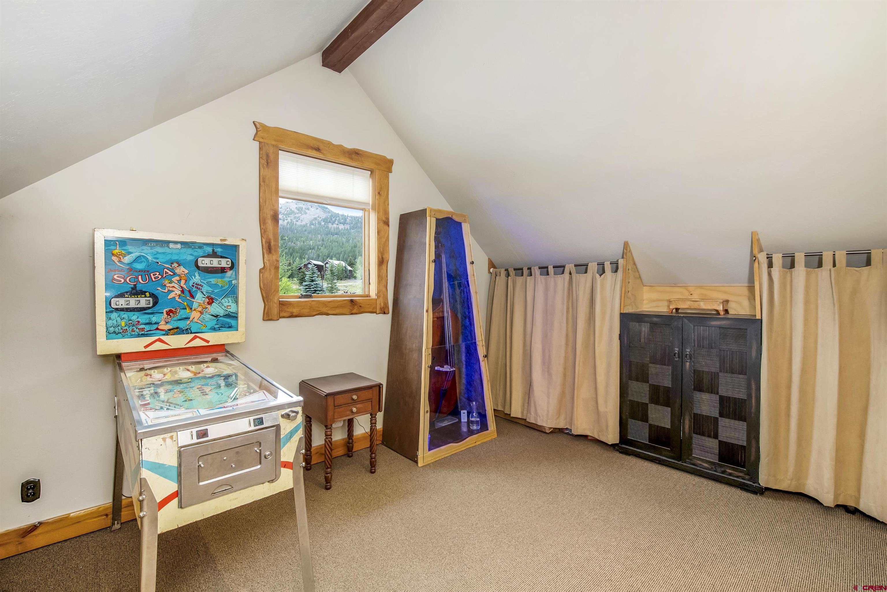 262 Larkspur Loop Crested Butte, CO 81224 - Photo 17 of 45 a view of a room with furniture and a window