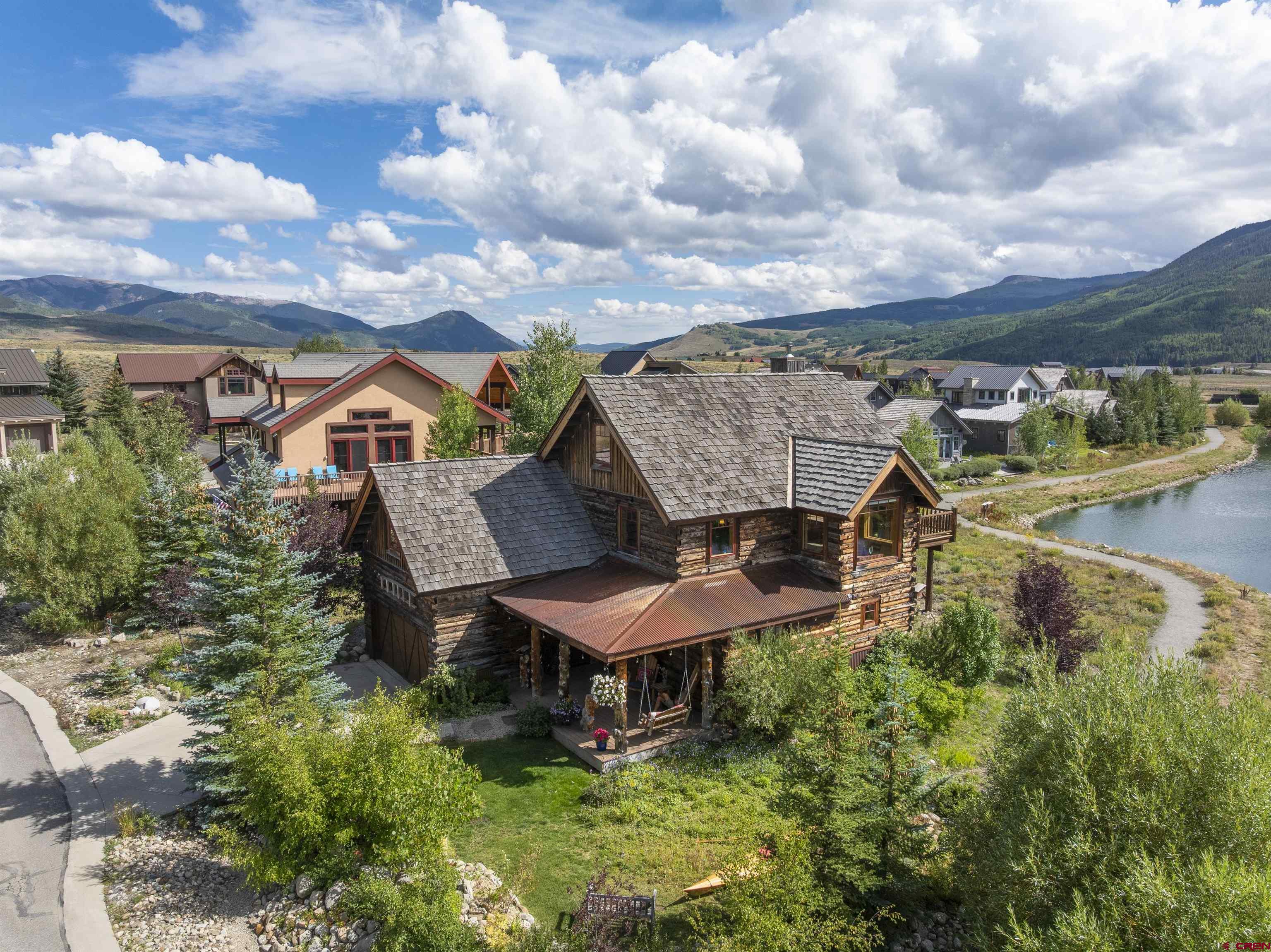 262 Larkspur Loop Crested Butte, CO 81224 - Photo 19 of 45 a view of a chairs and table in a backyard