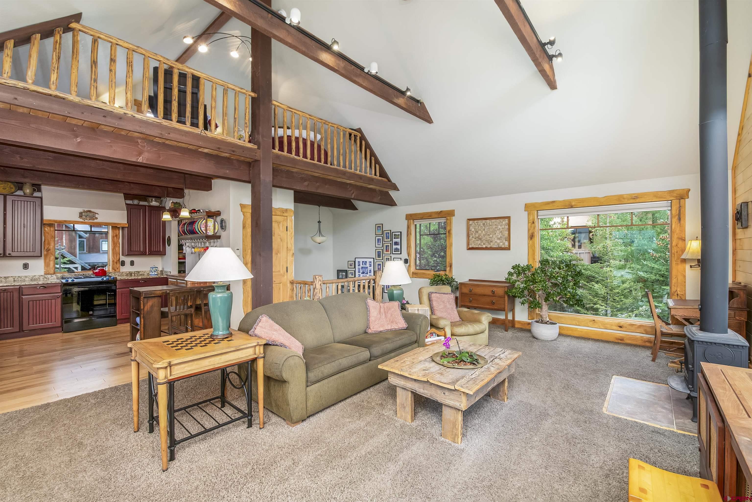 262 Larkspur Loop Crested Butte, CO 81224 - Photo 23 of 45 a living room with furniture a rug and a large window