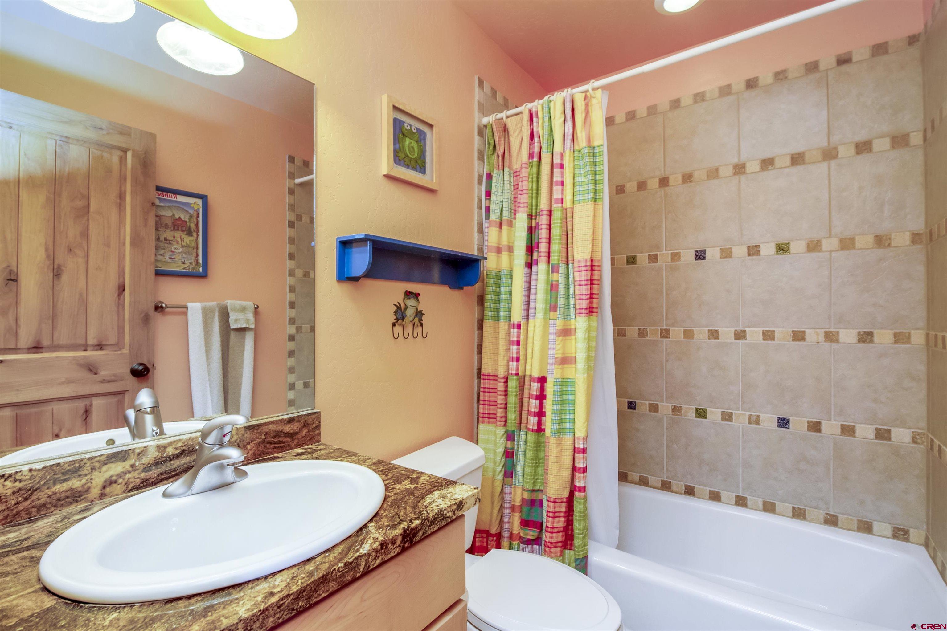 262 Larkspur Loop Crested Butte, CO 81224 - Photo 25 of 45 a bathroom with a sink toilet and shower