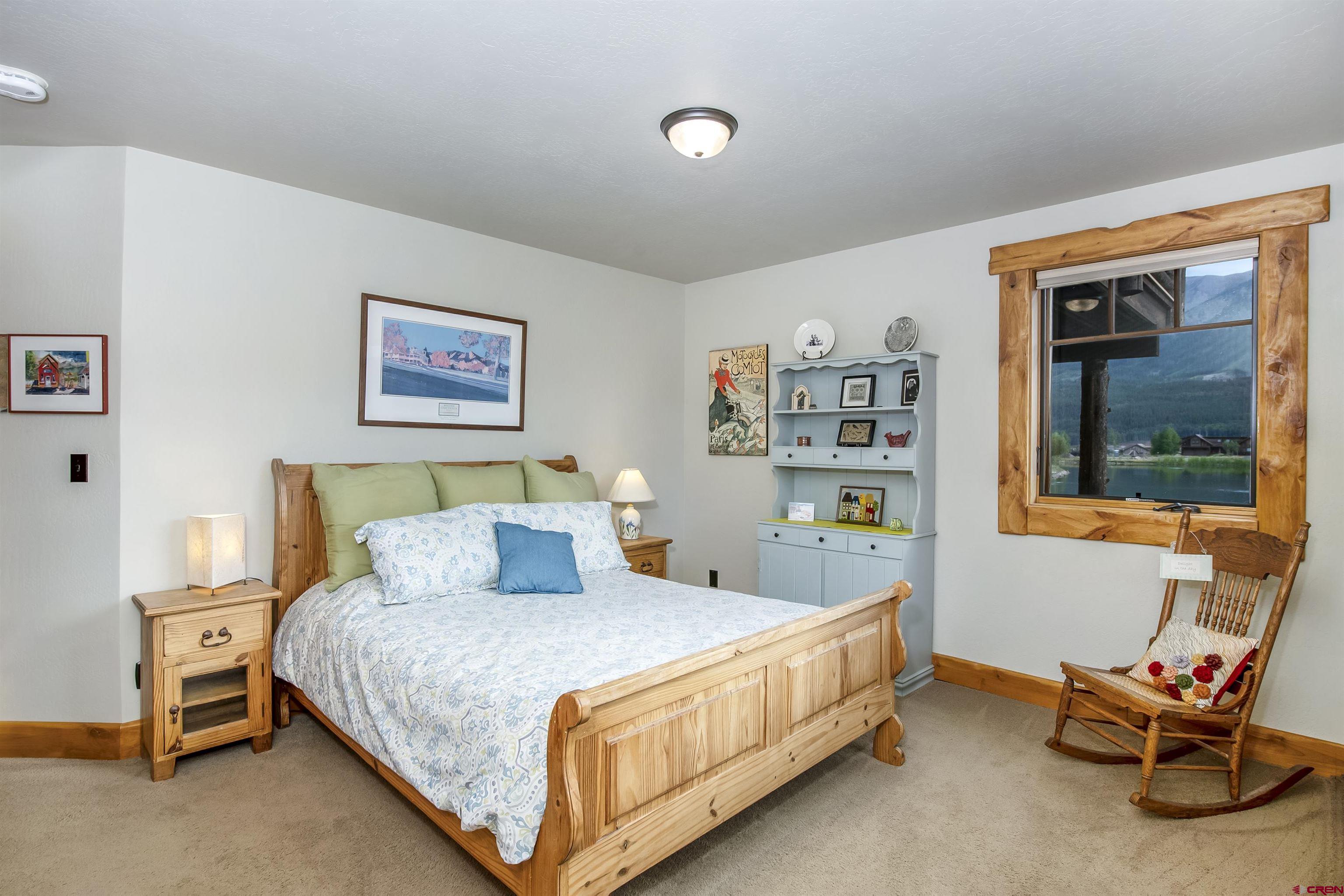 262 Larkspur Loop Crested Butte, CO 81224 - Photo 29 of 45 a bedroom with a bed and a window