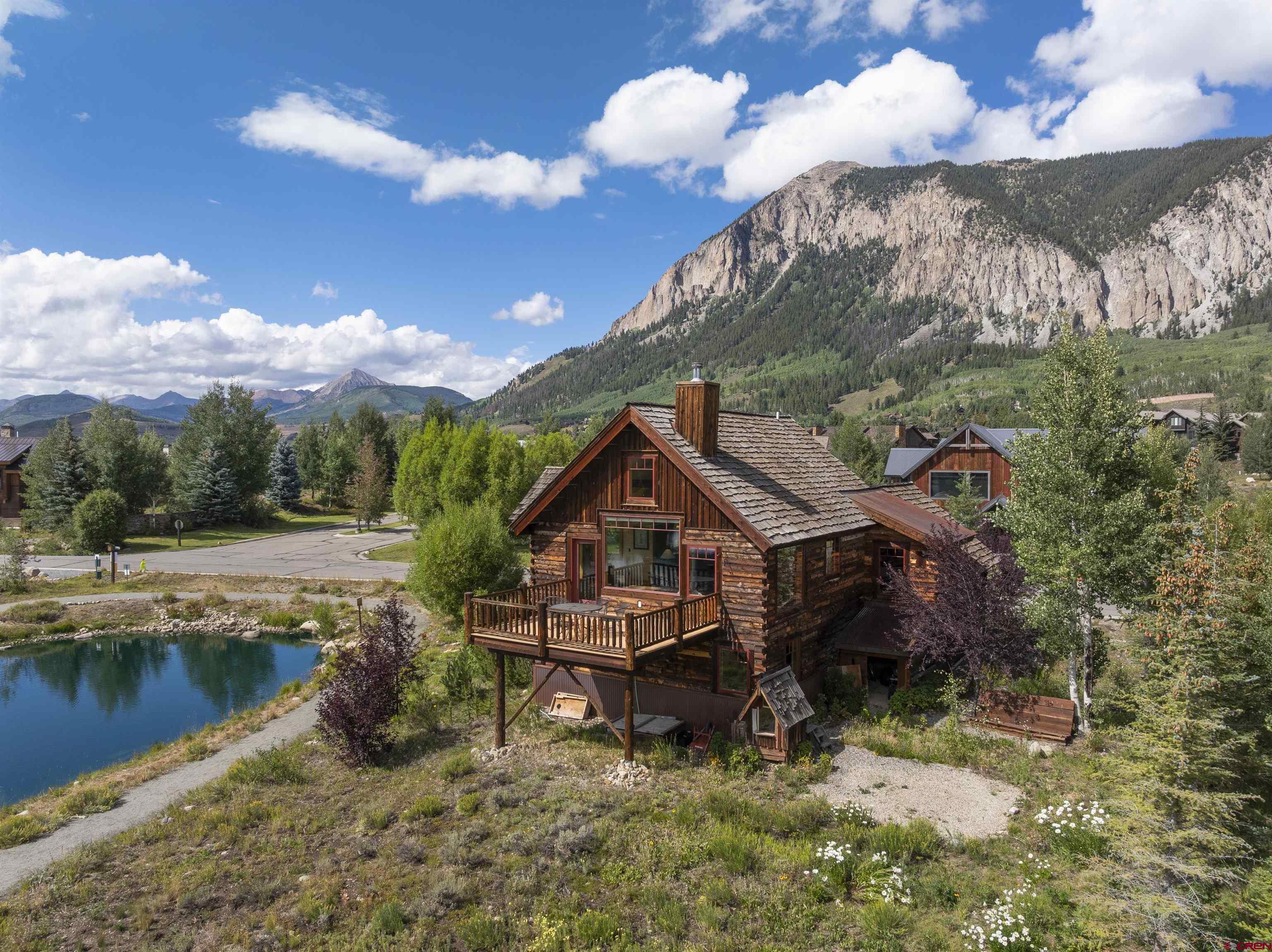 262 Larkspur Loop Crested Butte, CO 81224 - Photo 43 of 45 a backyard of a house with table and chairs