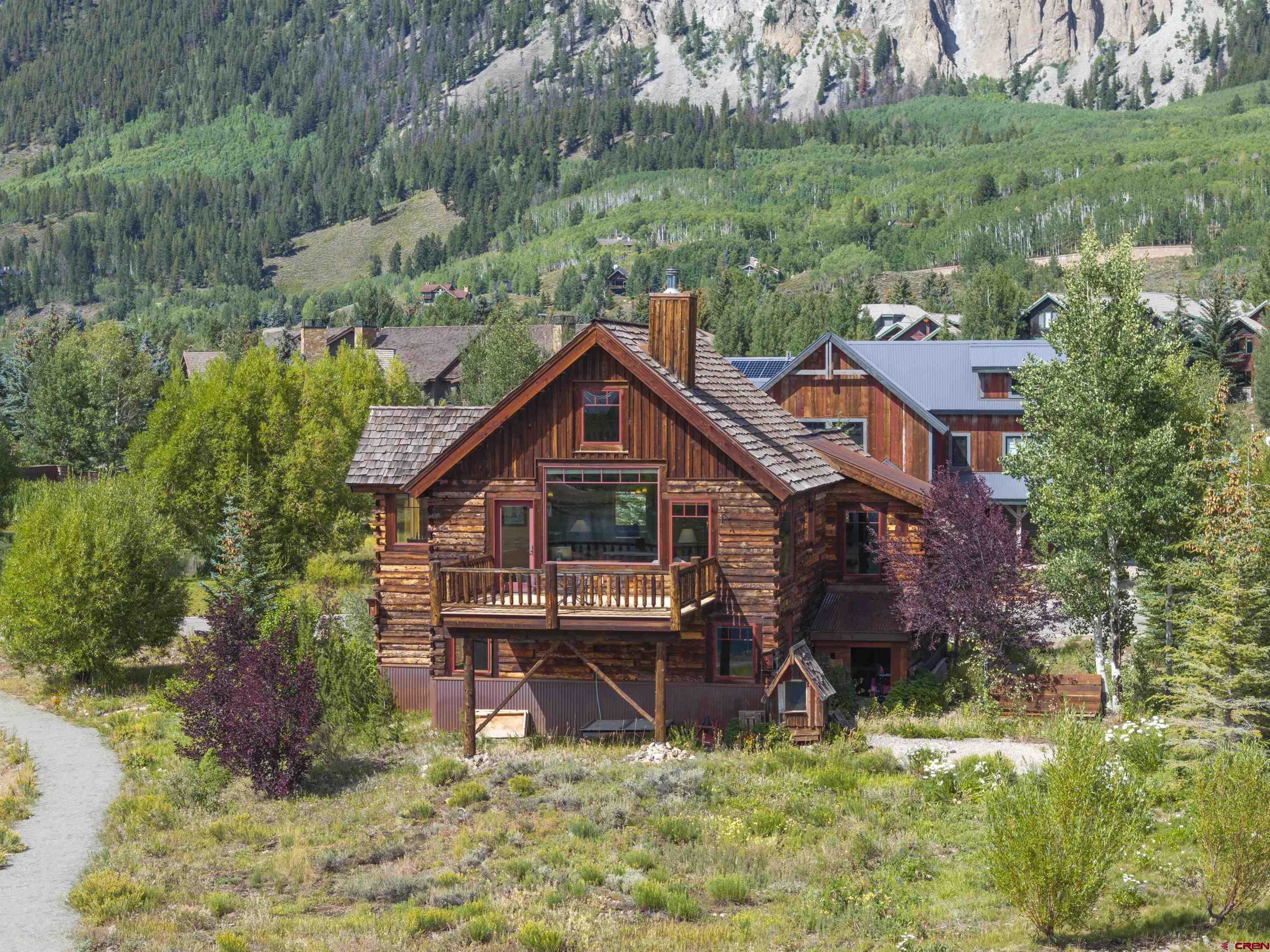 262 Larkspur Loop Crested Butte, CO 81224 - Photo 44 of 45 a aerial view of a house with a yard table and chairs