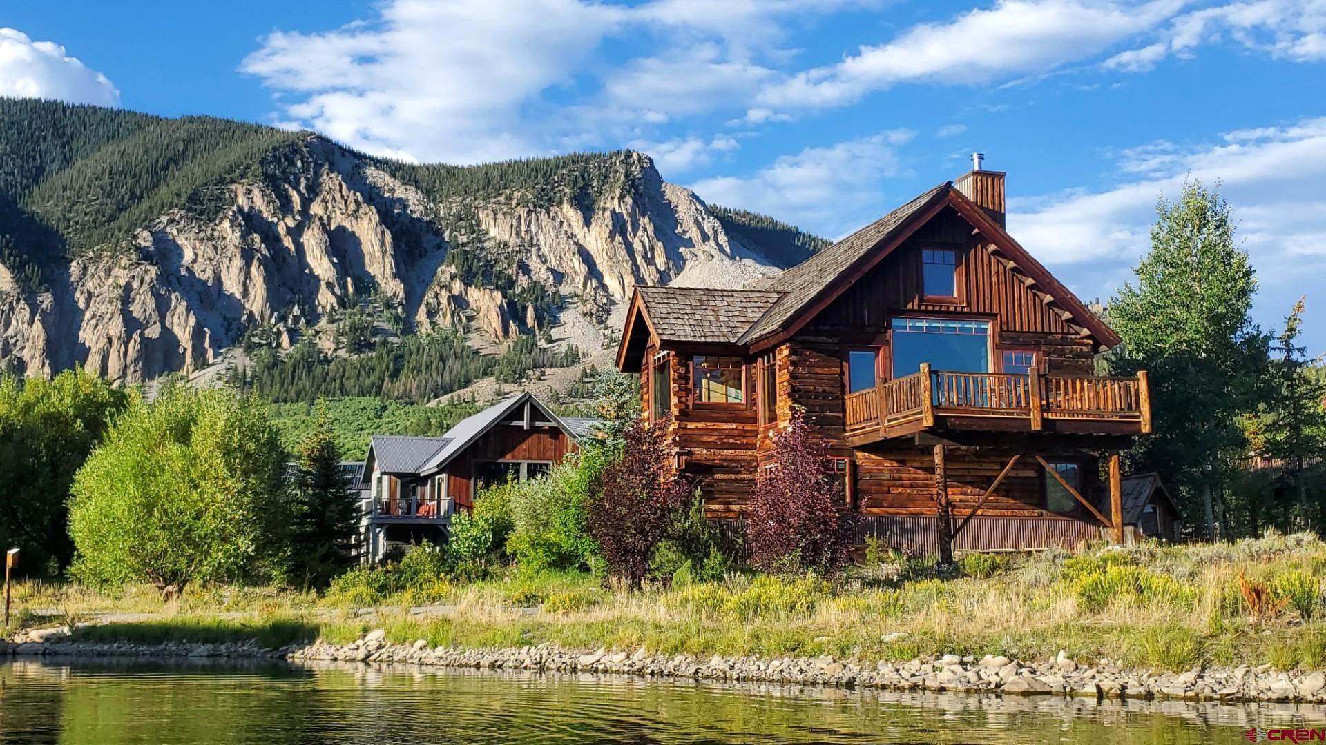 262 Larkspur Loop Crested Butte, CO 81224 - Photo 5 of 45 a aerial view of a house with swimming pool a yard and a fountain