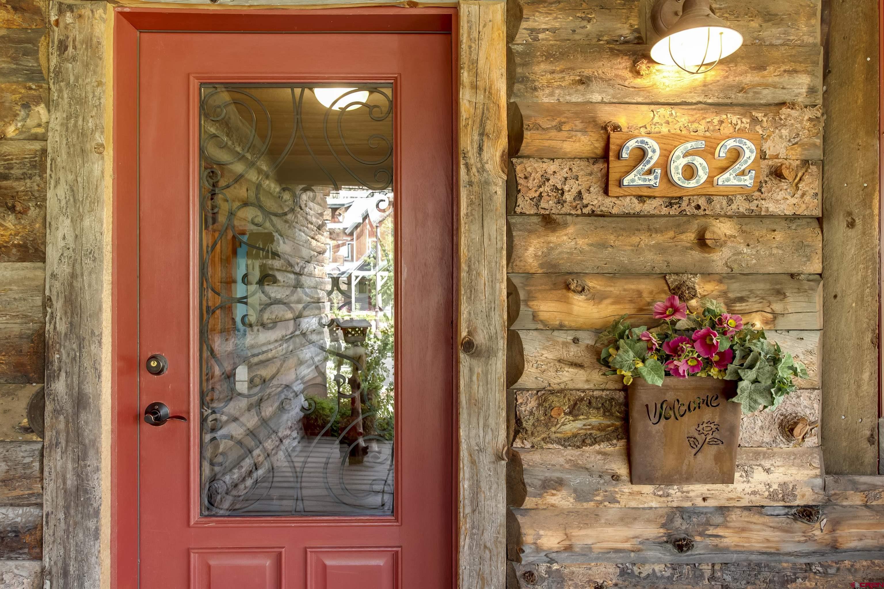 262 Larkspur Loop Crested Butte, CO 81224 - Photo 8 of 45 a bunch of flowers in a glass door