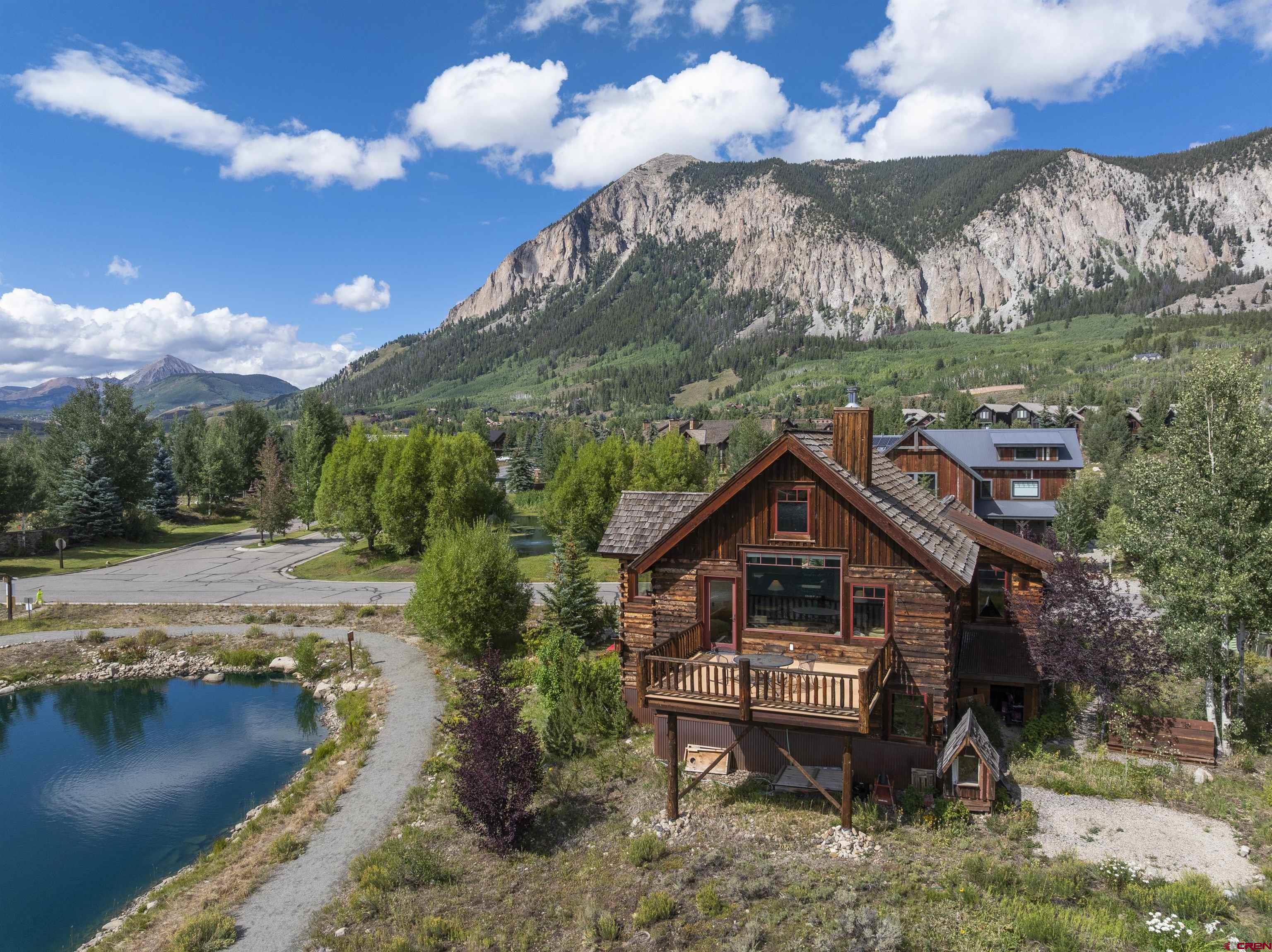 262 Larkspur Loop Crested Butte, CO 81224 - Photo 9 of 45 a backyard of a house with table and chairs