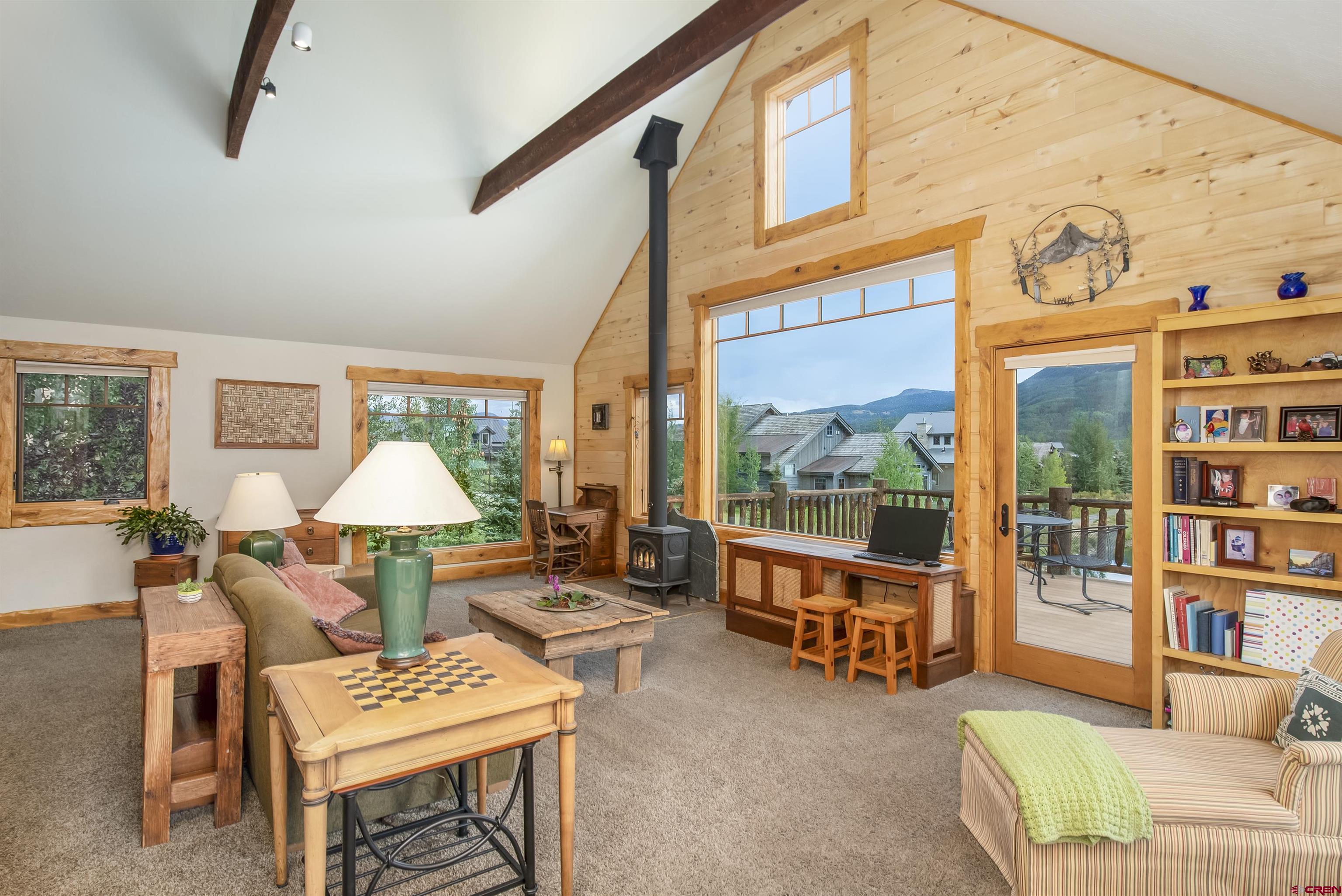 262 Larkspur Loop Crested Butte, CO 81224 - Photo 10 of 45 a living room with furniture and a large window