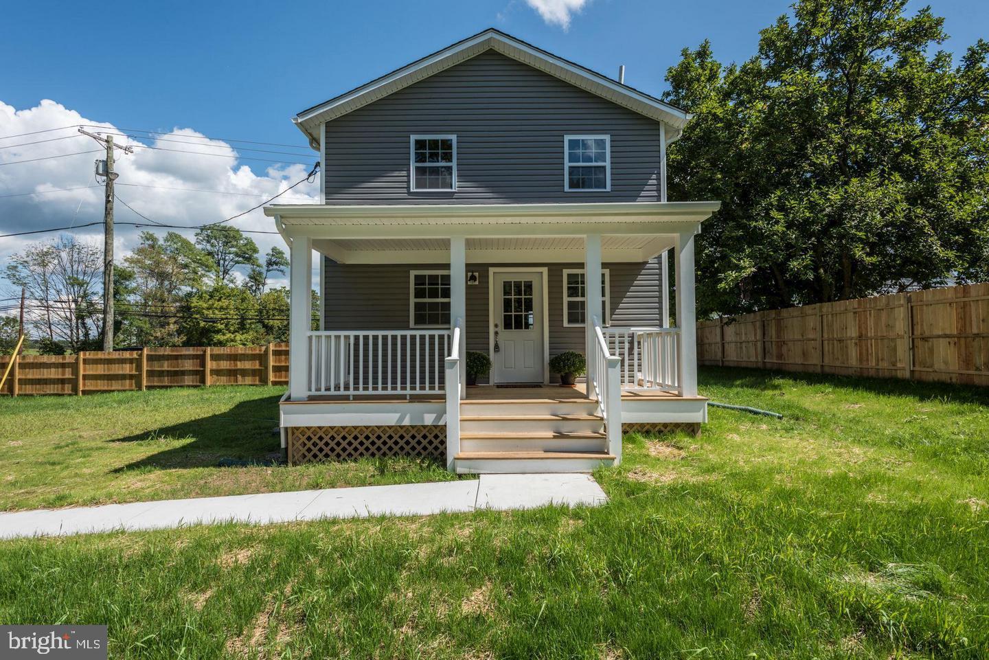 a view of a house with a yard and plants