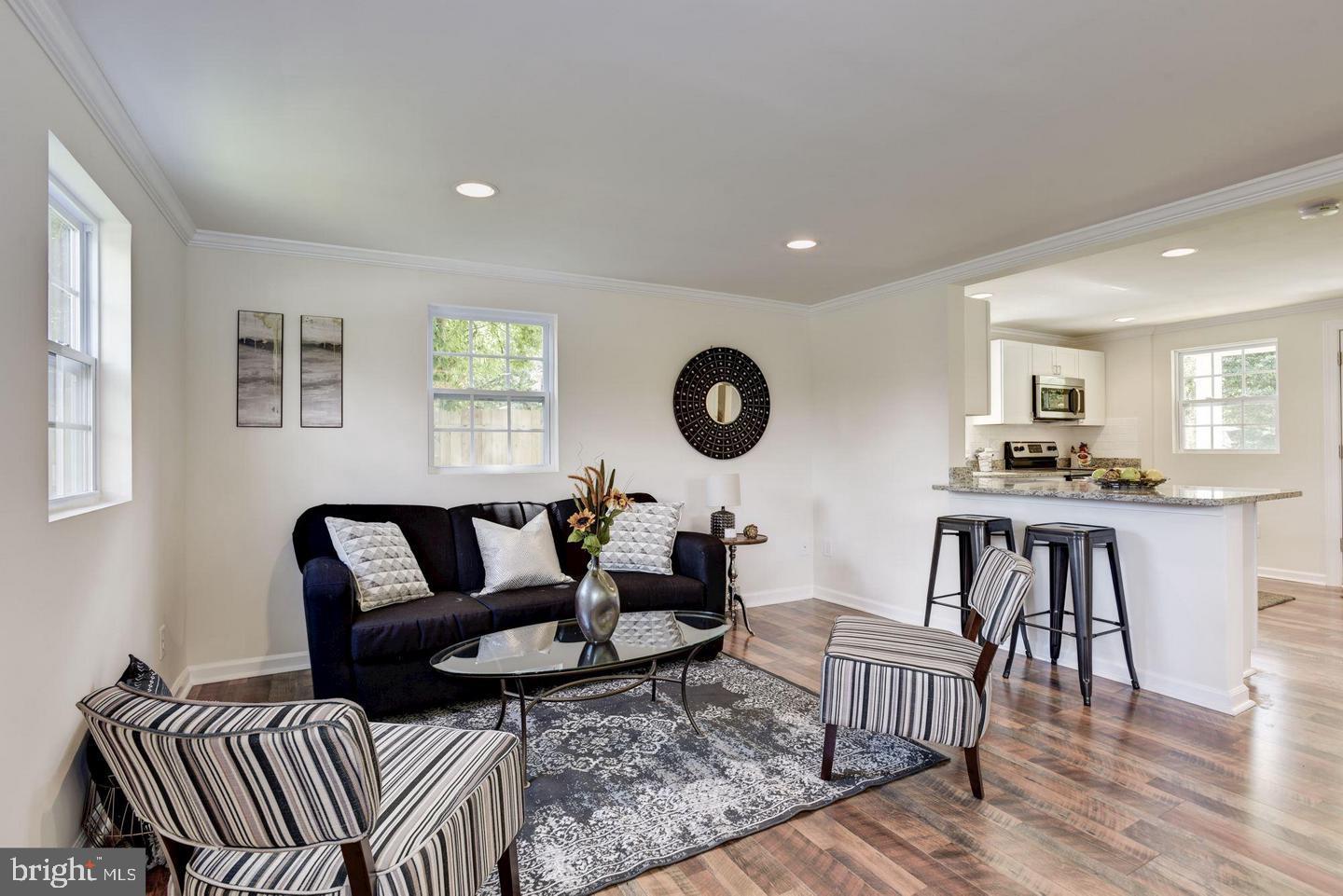 2440 Millers Mill Road Glenwood, MD 21738 - Photo 11 of 25 a living room with furniture and a wooden floor