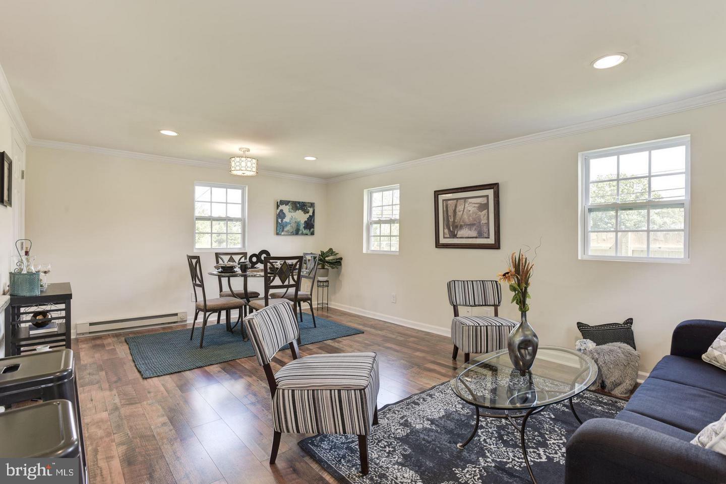 2440 Millers Mill Road Glenwood, MD 21738 - Photo 12 of 25 a view of a dining room with furniture window and wooden floor