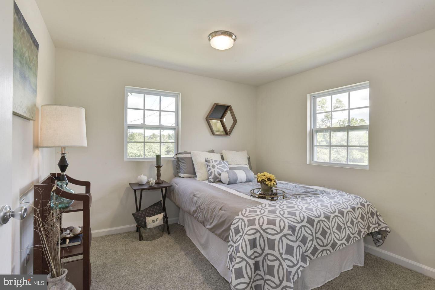 2440 Millers Mill Road Glenwood, MD 21738 - Photo 16 of 25 a bedroom with bed and a window