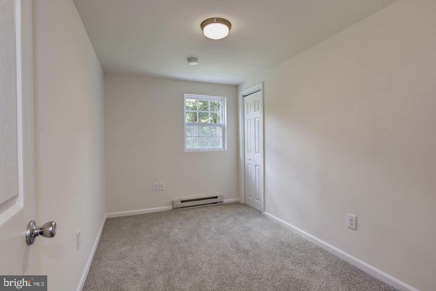 2440 Millers Mill Road Glenwood, MD 21738 - Photo 17 of 25 an empty room with windows