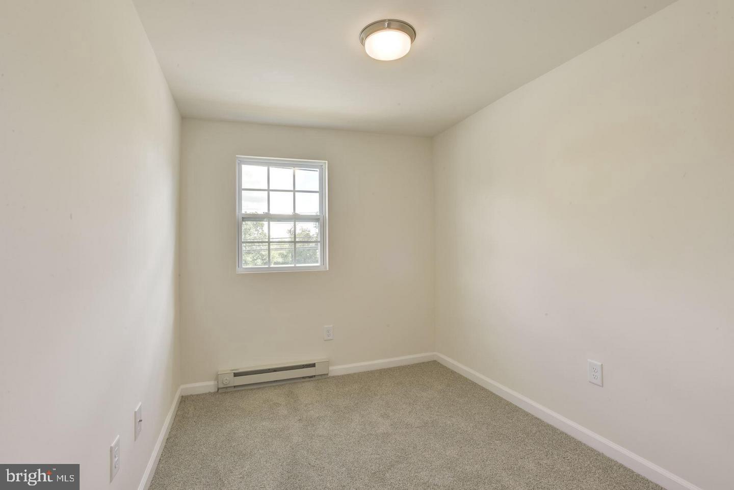 2440 Millers Mill Road Glenwood, MD 21738 - Photo 19 of 25 an empty room with a window
