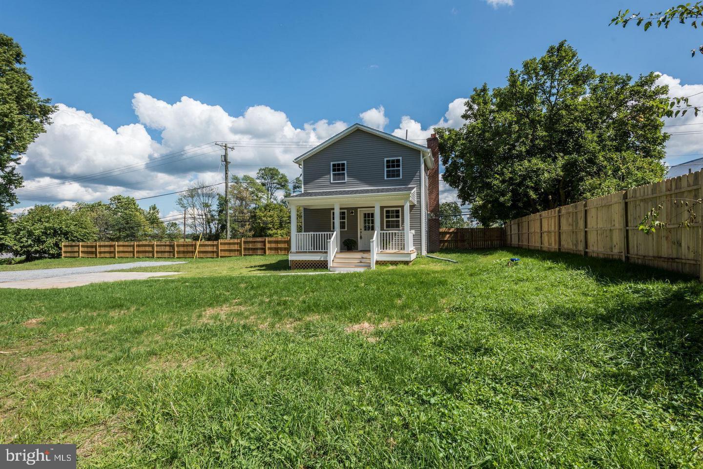 2440 Millers Mill Road Glenwood, MD 21738 - Photo 2 of 25 a front view of a house with garden