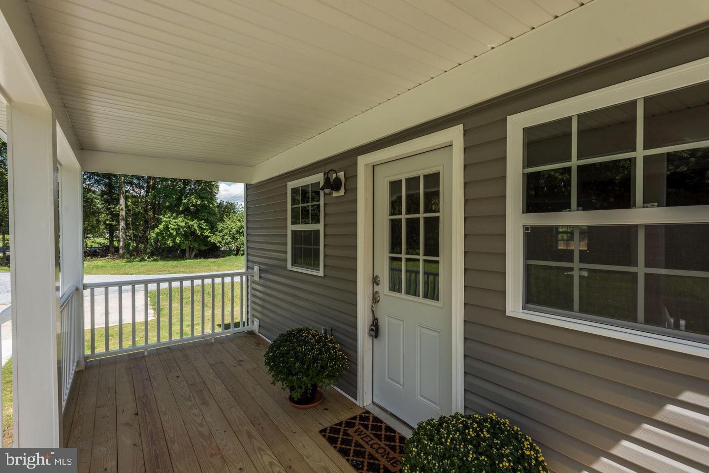 2440 Millers Mill Road Glenwood, MD 21738 - Photo 4 of 25 a porch with a bench