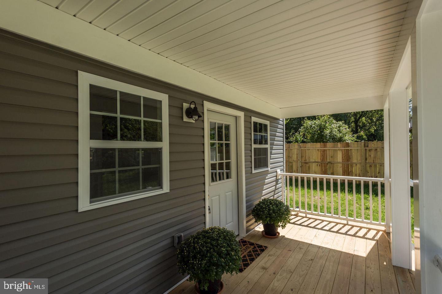 2440 Millers Mill Road Glenwood, MD 21738 - Photo 5 of 25 a view of a deck with a chair