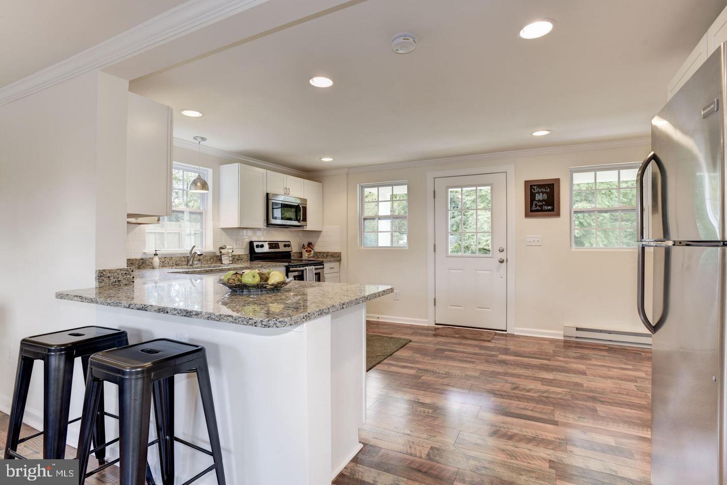 2440 Millers Mill Road Glenwood, MD 21738 - Photo 8 of 25 a kitchen with stainless steel appliances granite countertop a refrigerator and a stove top oven