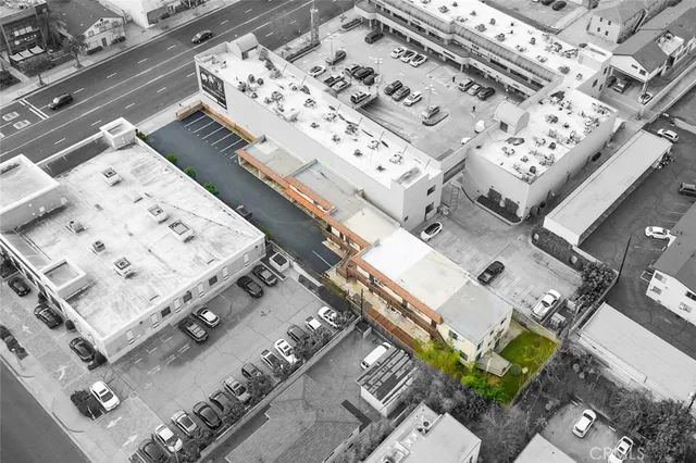 an aerial view of a house with swimming pool