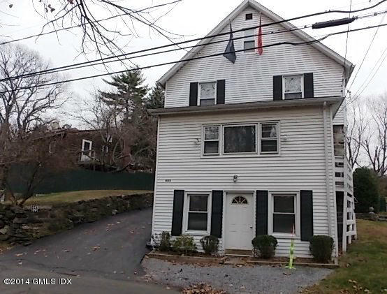 571 River Road Cos Cob, CT 06870 - Photo 8 of 8 a view of a white house with large space and a street