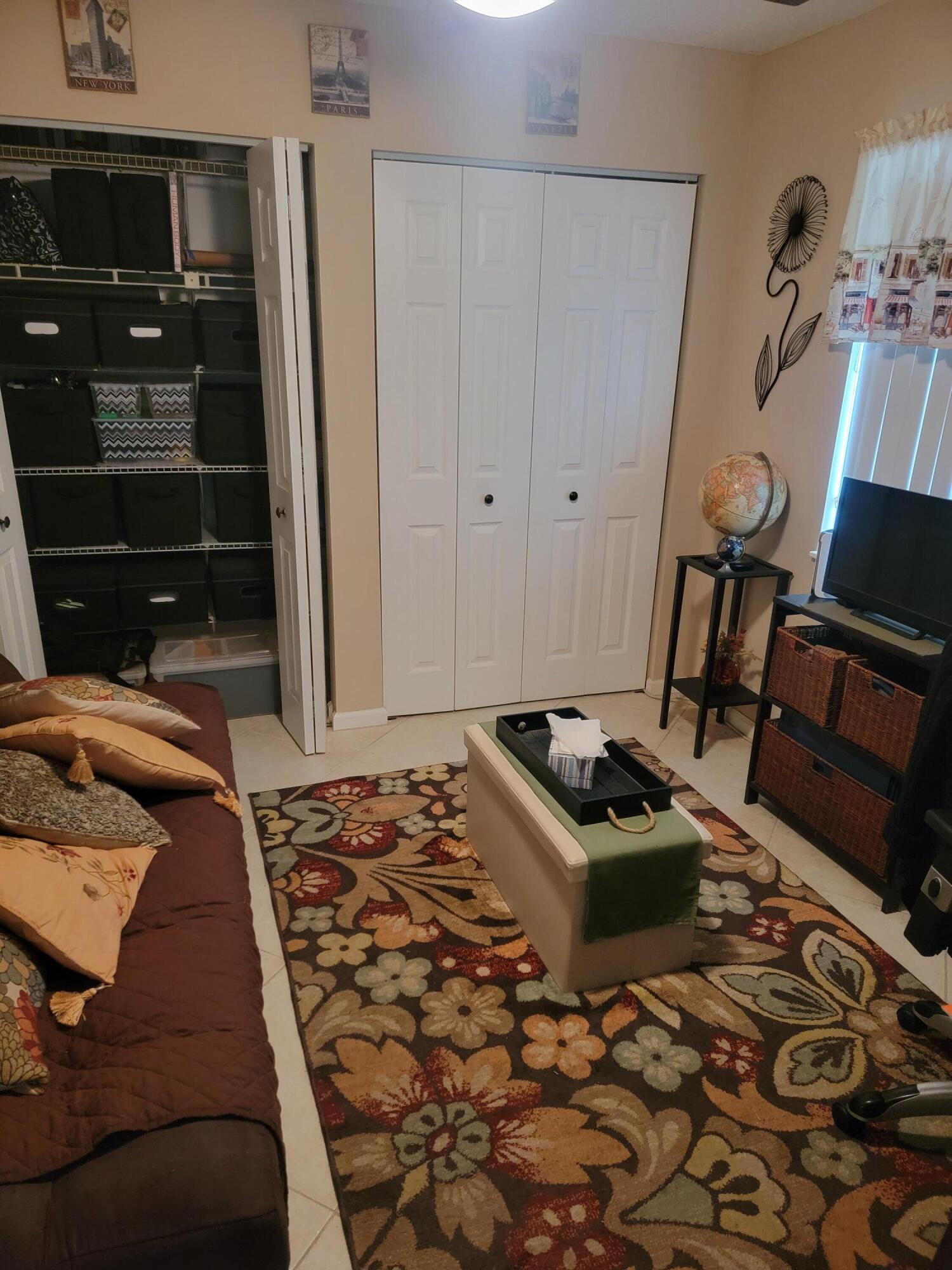 27 Vista Del Rio Boynton Beach, FL 33426 - Photo 15 of 33 a bedroom with a bed and a mirror