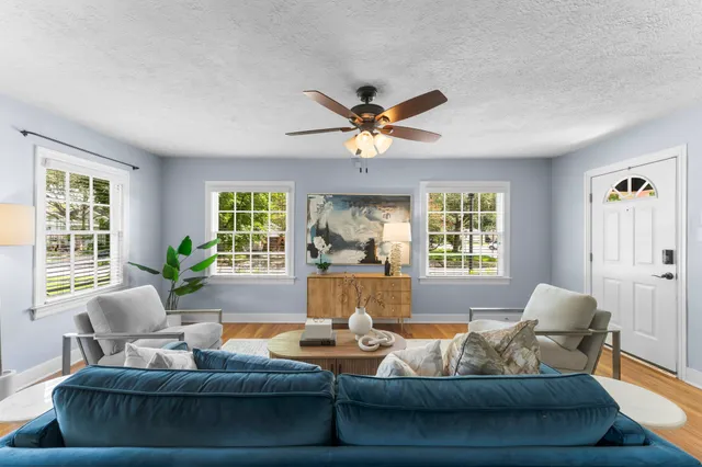 a living room with furniture and a large window