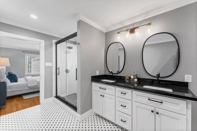 a bathroom with a granite countertop sink mirror and vanity
