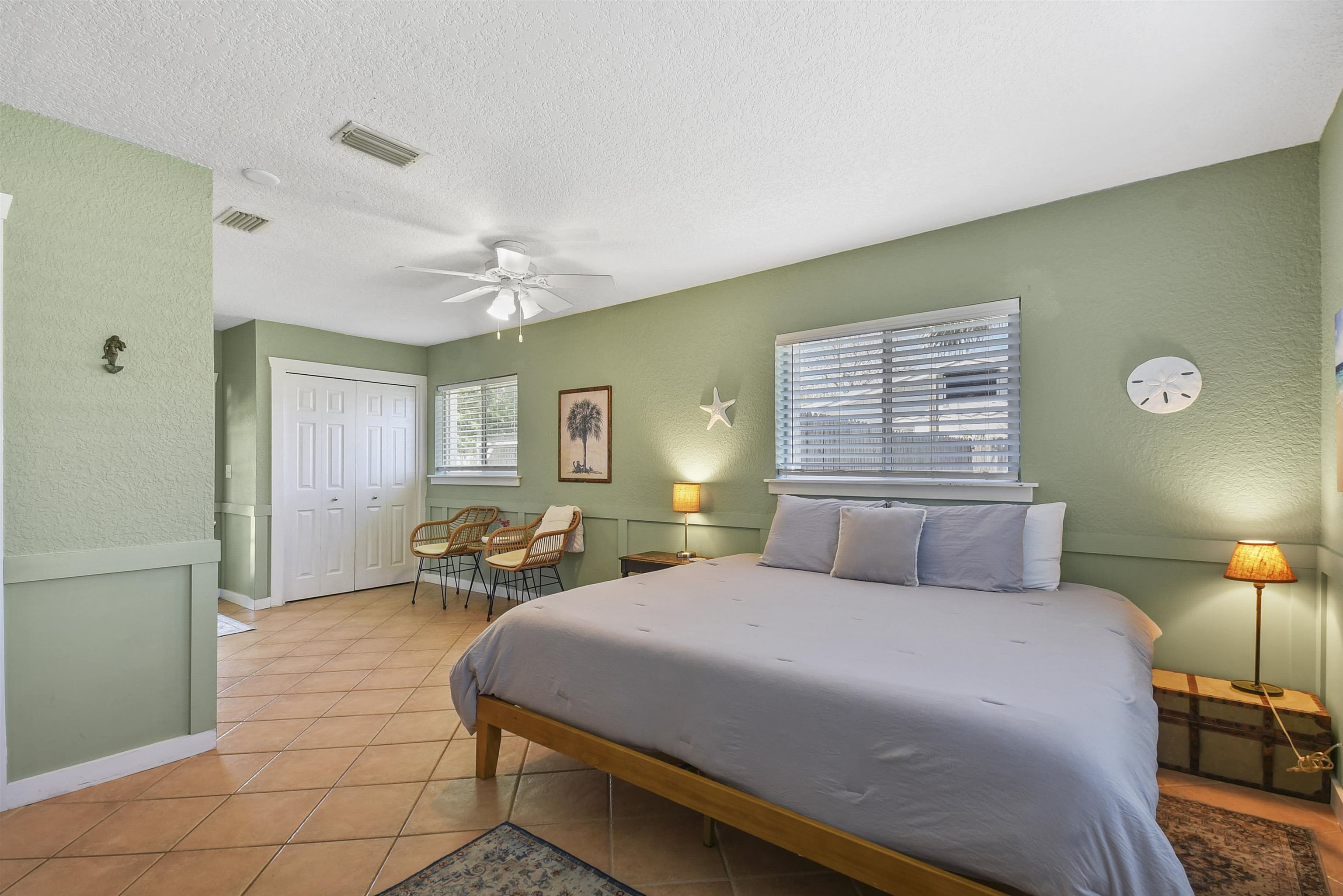 5479 2nd Street St. Augustine, FL 32080 - Photo 13 of 31 a bedroom with a bed and wooden floor