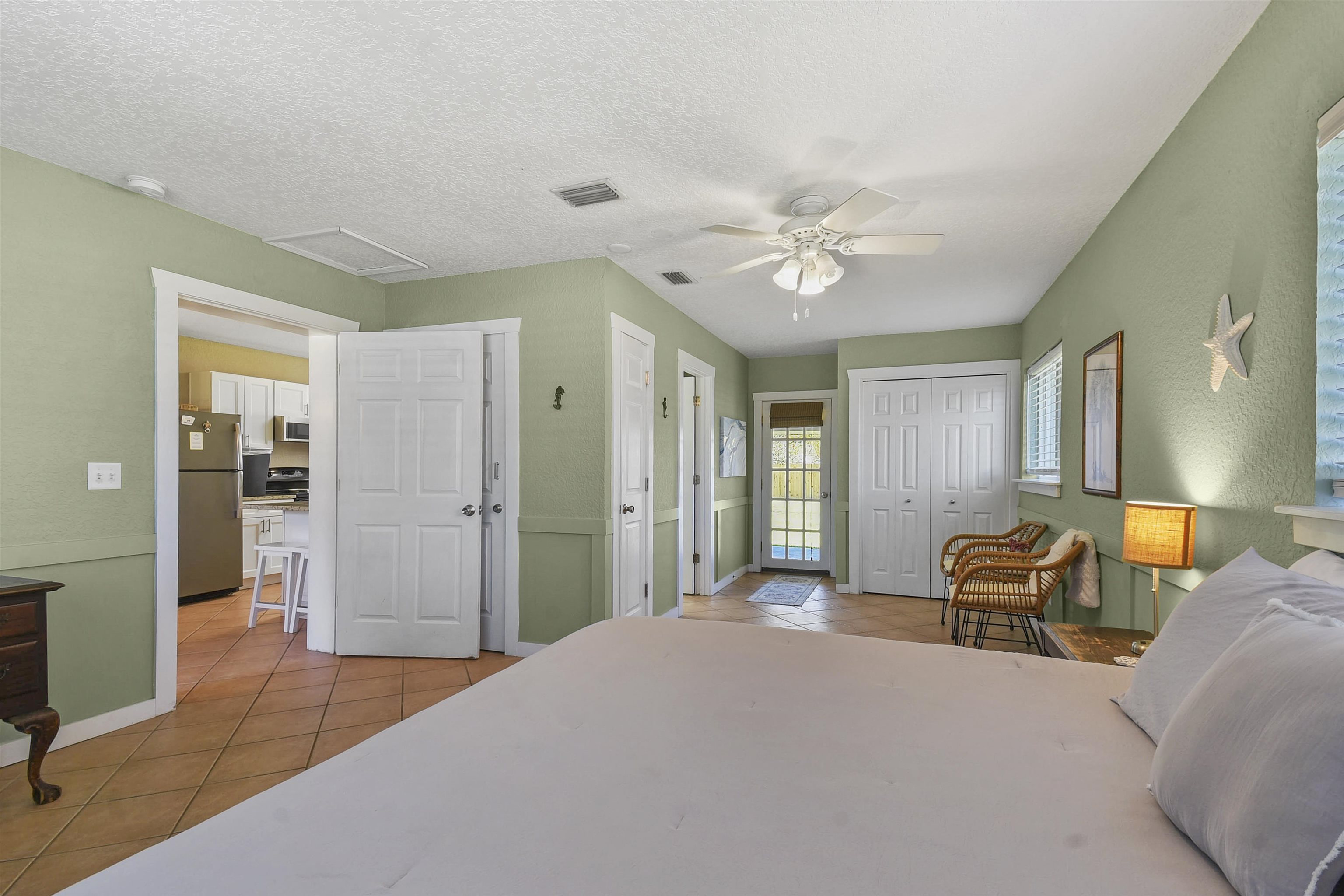 5479 2nd Street St. Augustine, FL 32080 - Photo 14 of 31 a bedroom with a bed and furniture