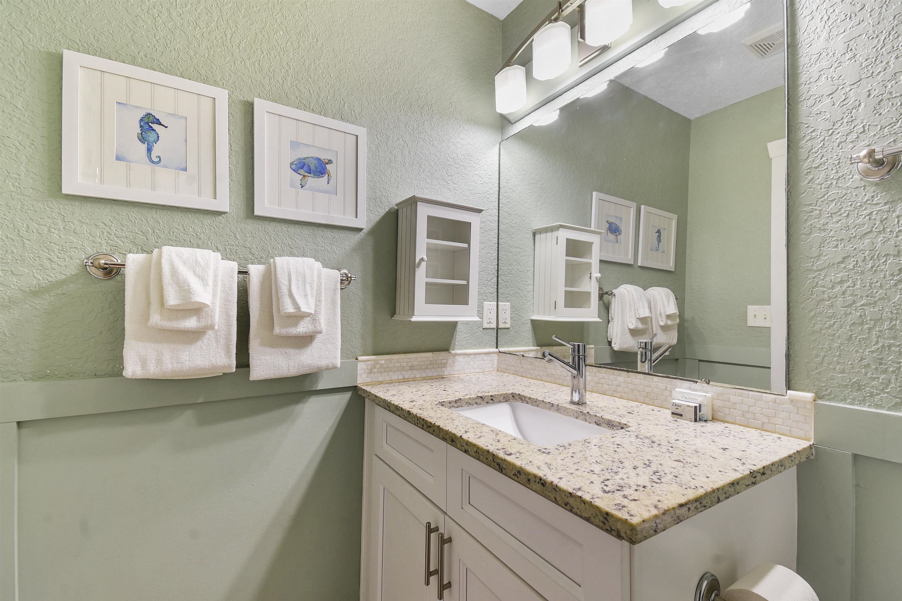 5479 2nd Street St. Augustine, FL 32080 - Photo 15 of 31 a bathroom with a granite countertop sink and a mirror