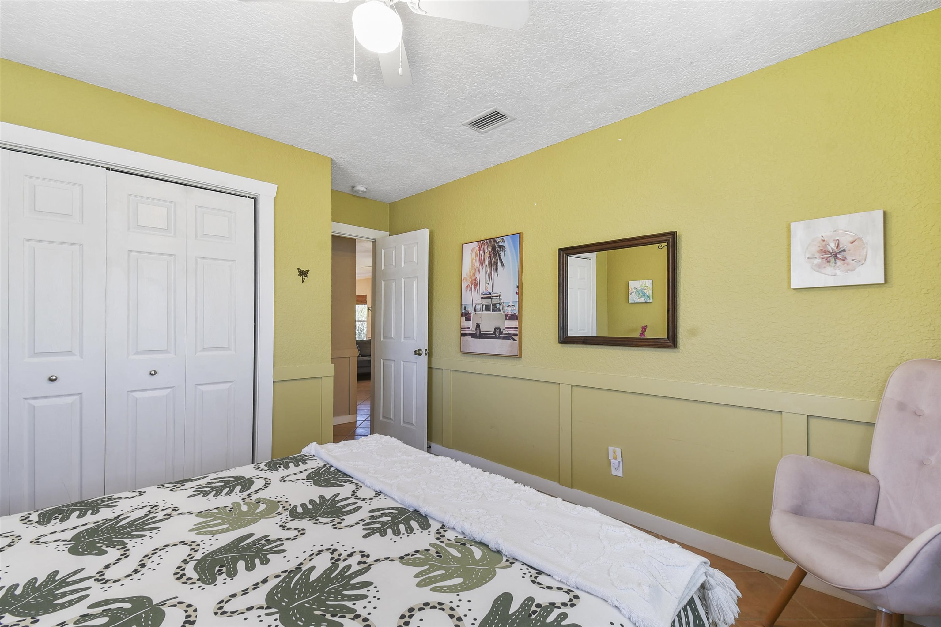 5479 2nd Street St. Augustine, FL 32080 - Photo 22 of 31 a bedroom with a bed and a cabinets