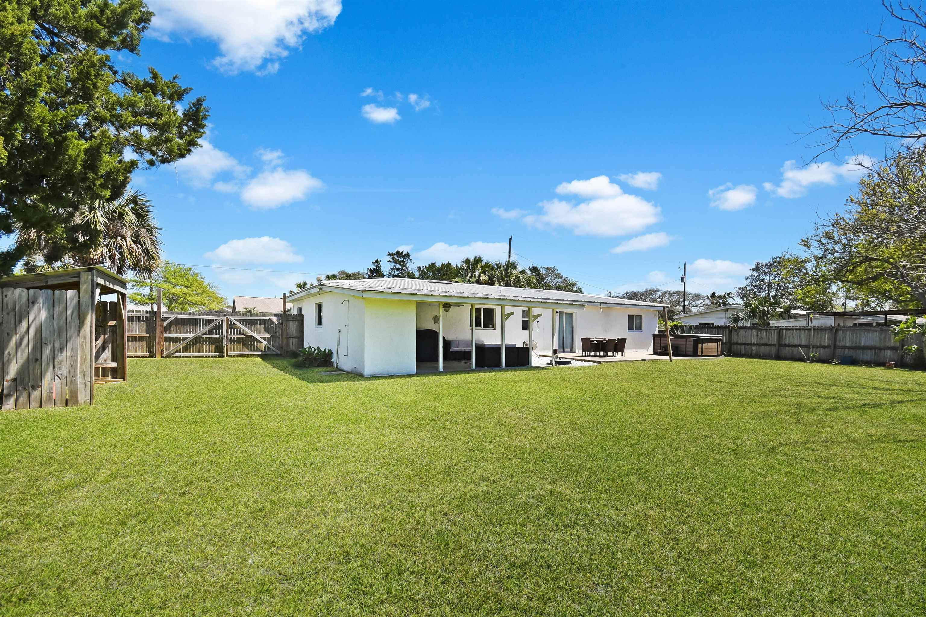 5479 2nd Street St. Augustine, FL 32080 - Photo 26 of 31 a view of a house with a big yard