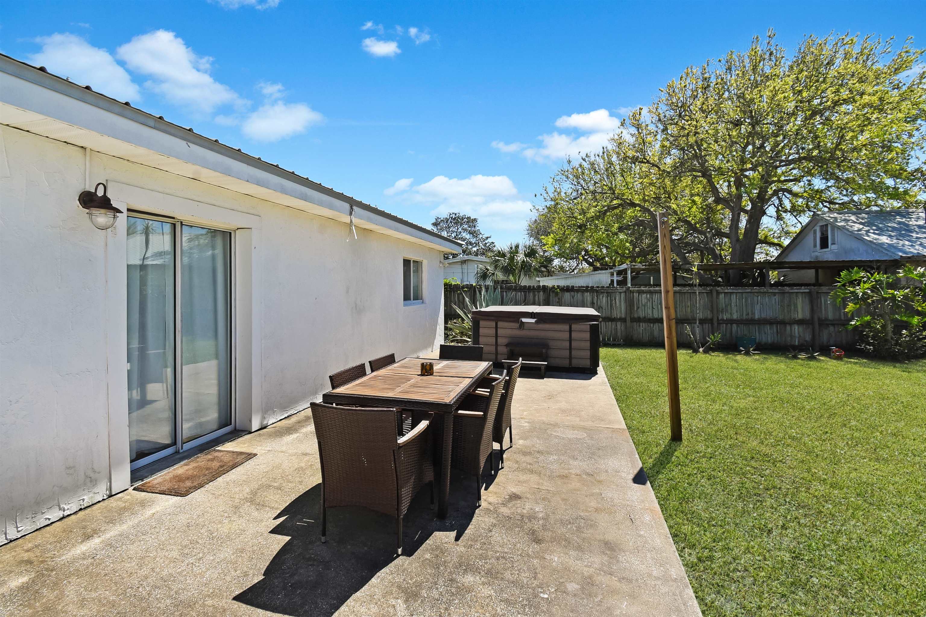 5479 2nd Street St. Augustine, FL 32080 - Photo 29 of 31 a patio with table and chairs
