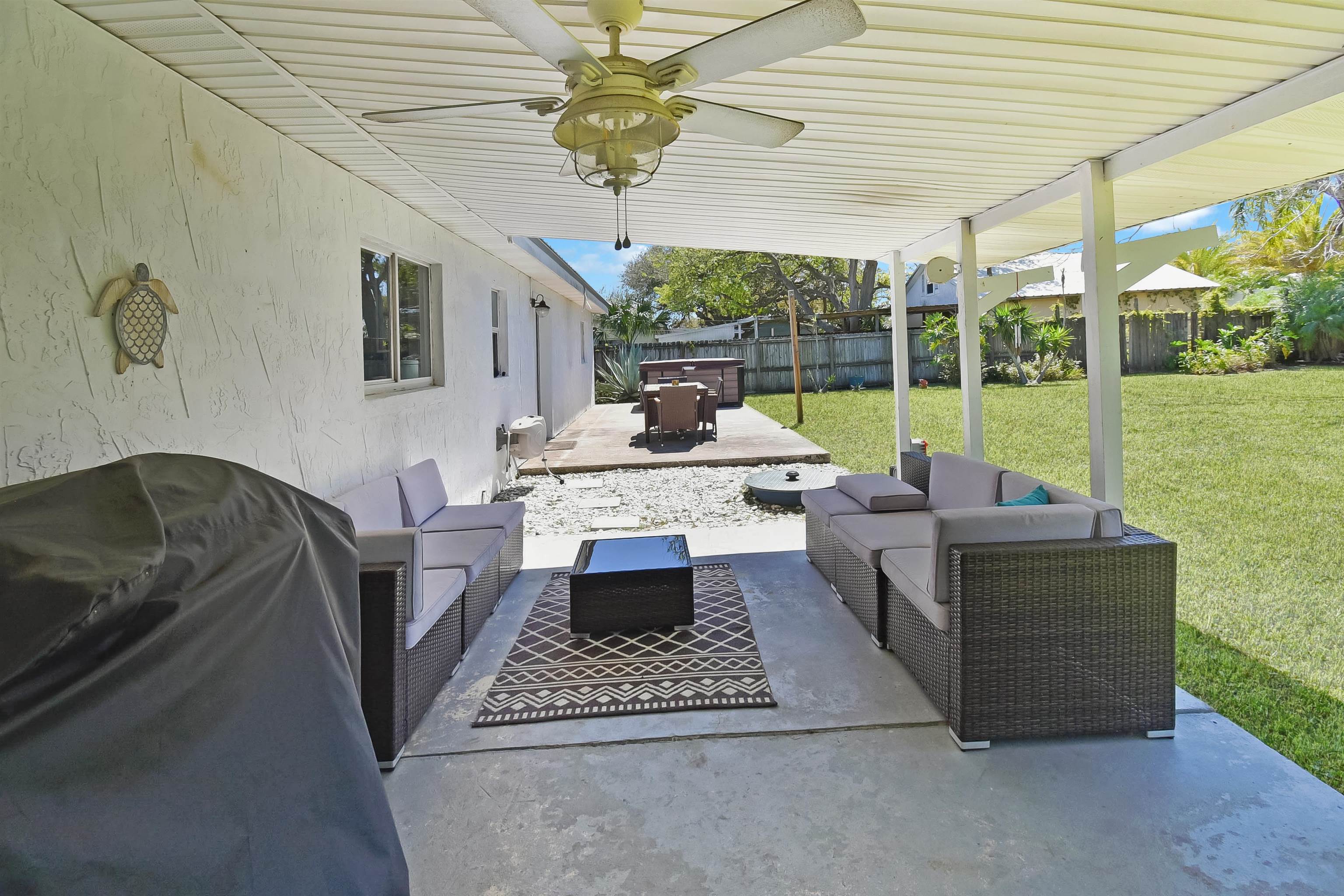 5479 2nd Street St. Augustine, FL 32080 - Photo 30 of 31 a living room with patio furniture and a floor to ceiling window