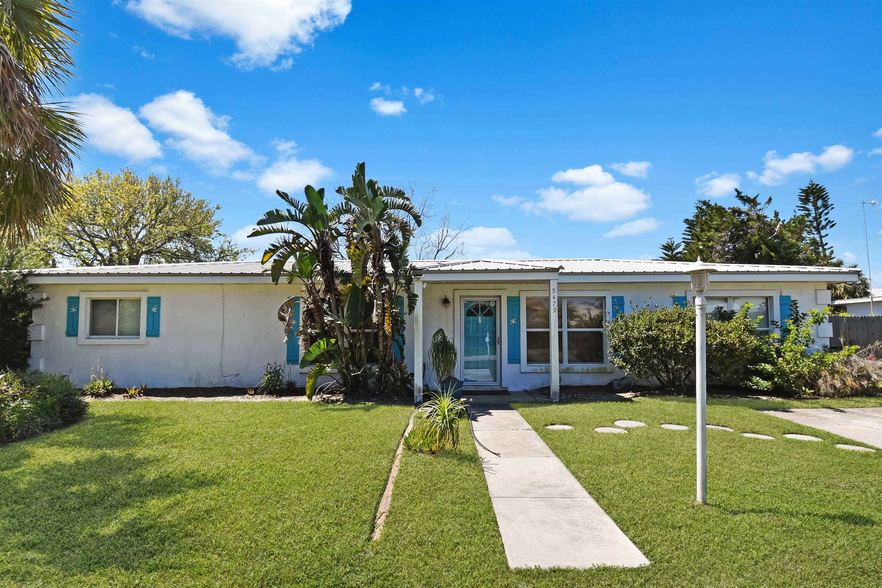 5479 2nd Street St. Augustine, FL 32080 - Photo 3 of 31 a view of a house with a yard and potted plants