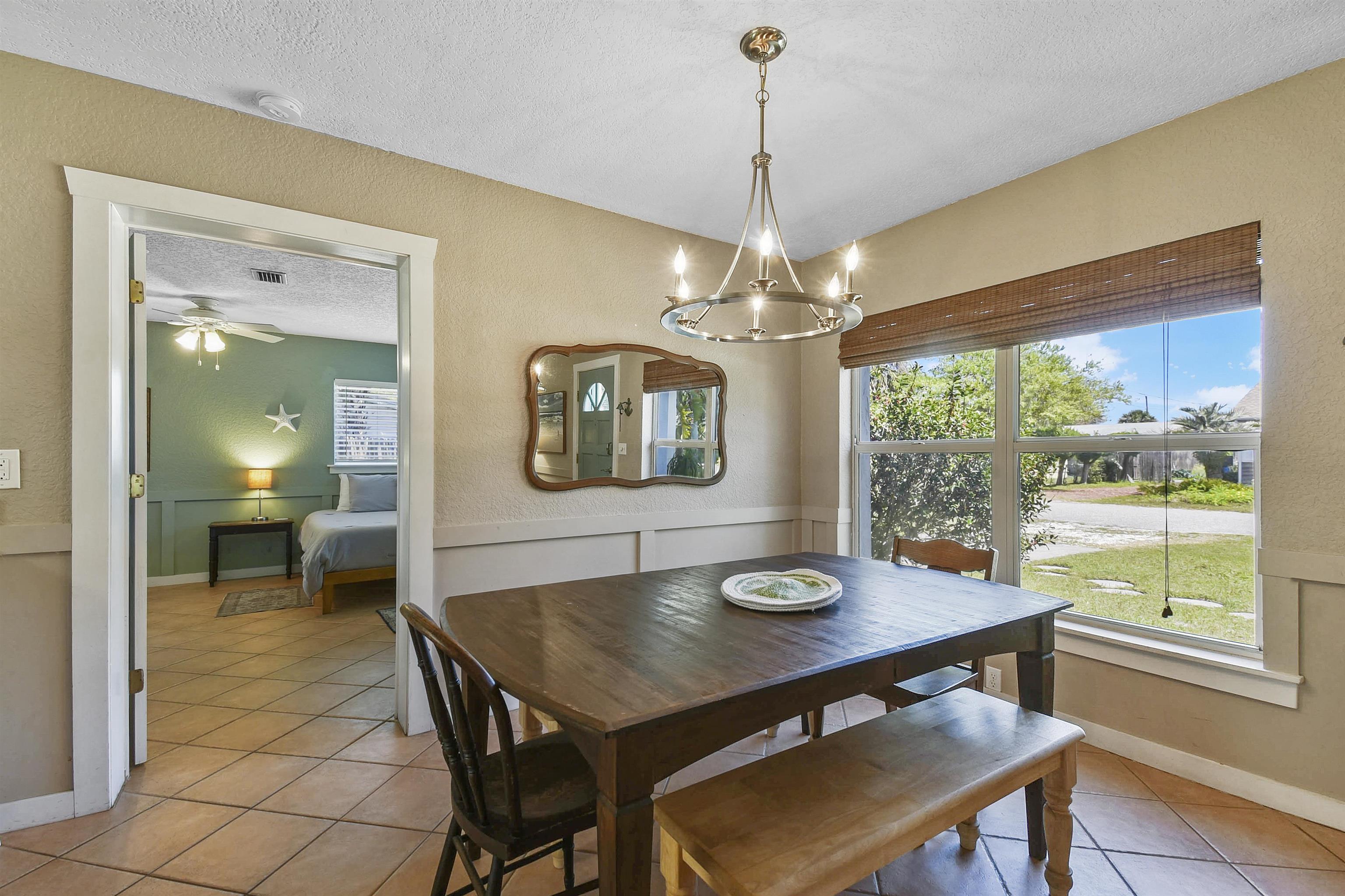 5479 2nd Street St. Augustine, FL 32080 - Photo 8 of 31 a view of a dining room with furniture window and wooden floor