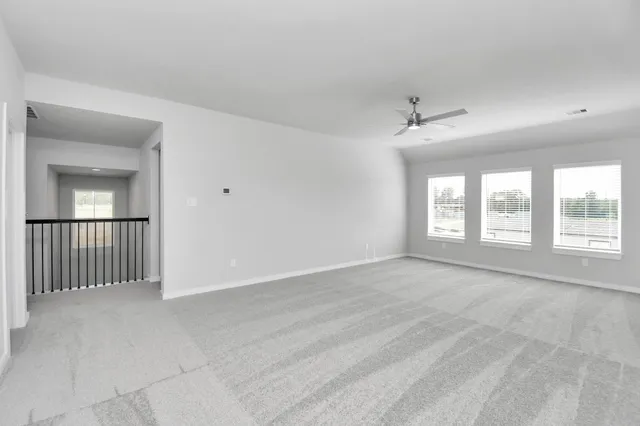 a view of a backyard with wooden fence