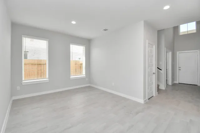 a kitchen with a stove sink and cabinets
