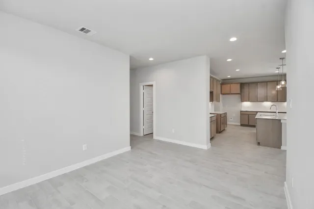 a kitchen with a sink vanity and chandelier