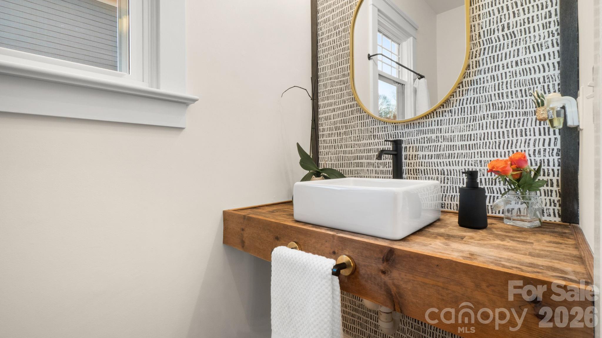 907 Derick's Crossing Fort Mill, SC 29708 - Photo 12 of 47 a bathroom with a sink and a mirror