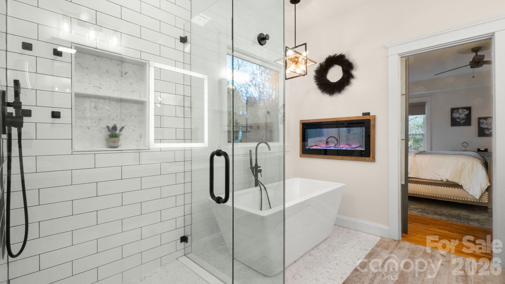 907 Derick's Crossing Fort Mill, SC 29708 - Photo 16 of 47 a bathroom with a sink a mirror and shower