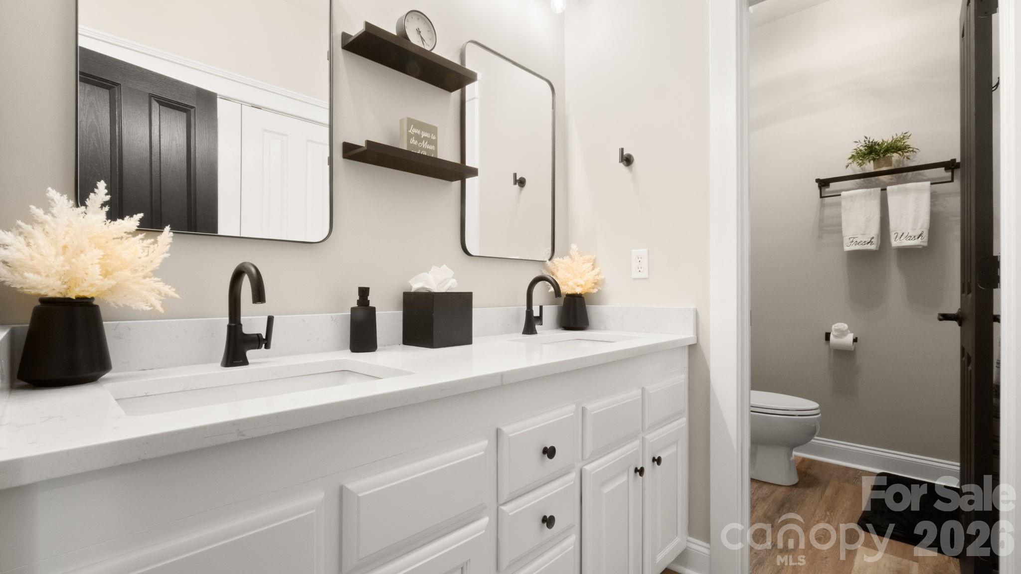 907 Derick's Crossing Fort Mill, SC 29708 - Photo 20 of 47 a bathroom with a double vanity sink and a mirror