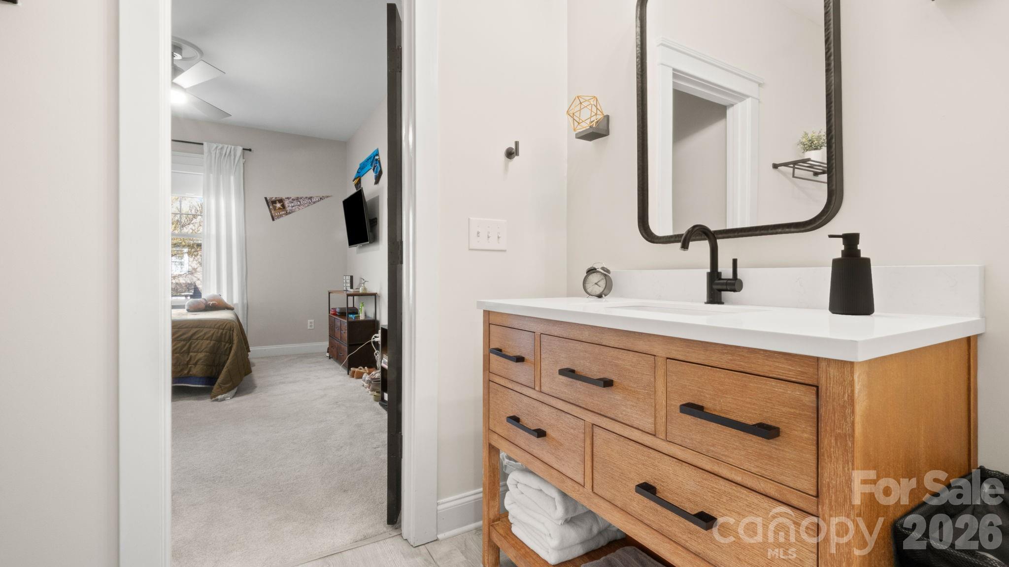 907 Derick's Crossing Fort Mill, SC 29708 - Photo 22 of 47 a bathroom with a double vanity sink and a mirror