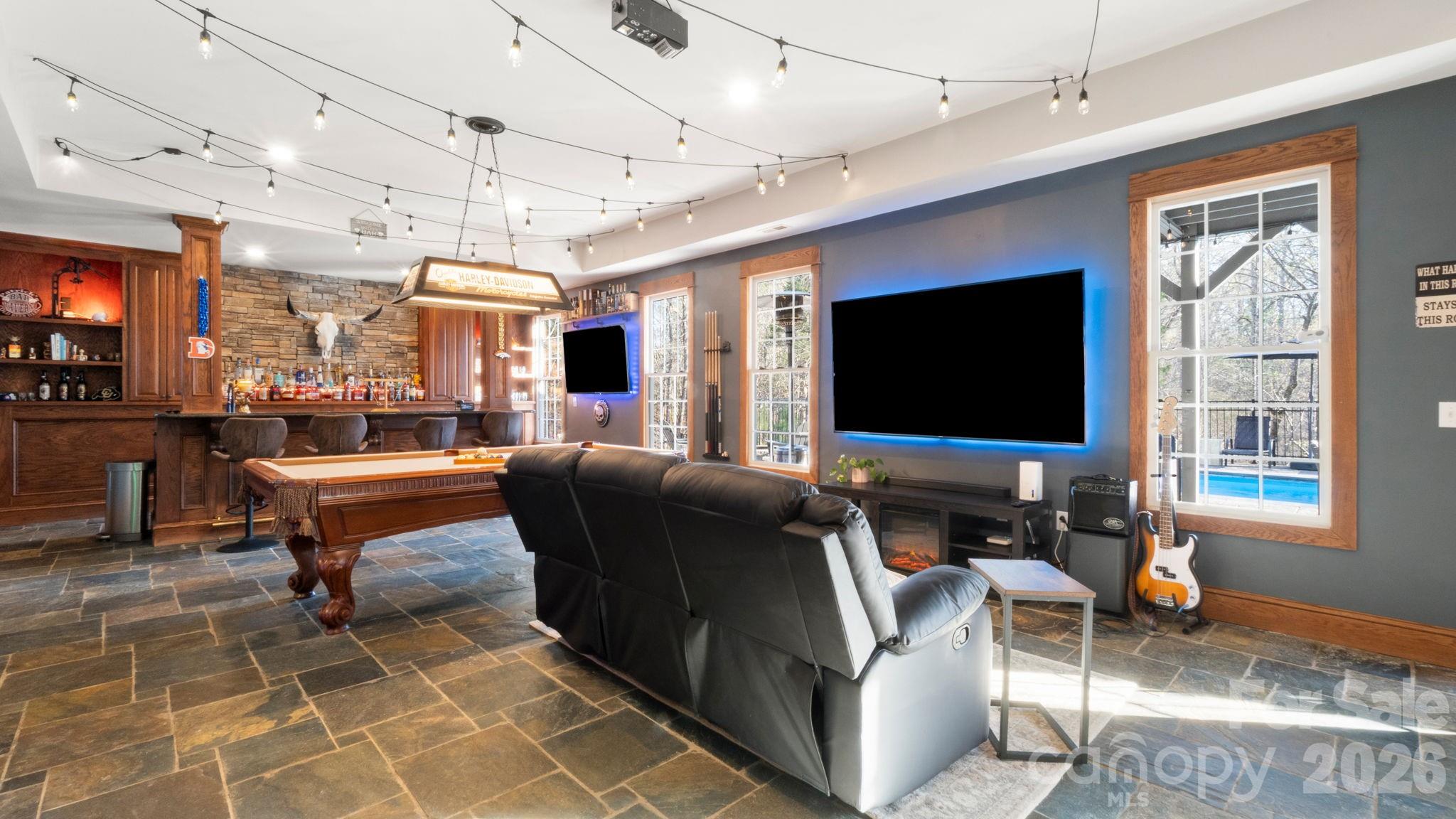 907 Derick's Crossing Fort Mill, SC 29708 - Photo 25 of 47 a living room with patio furniture and a flat screen tv