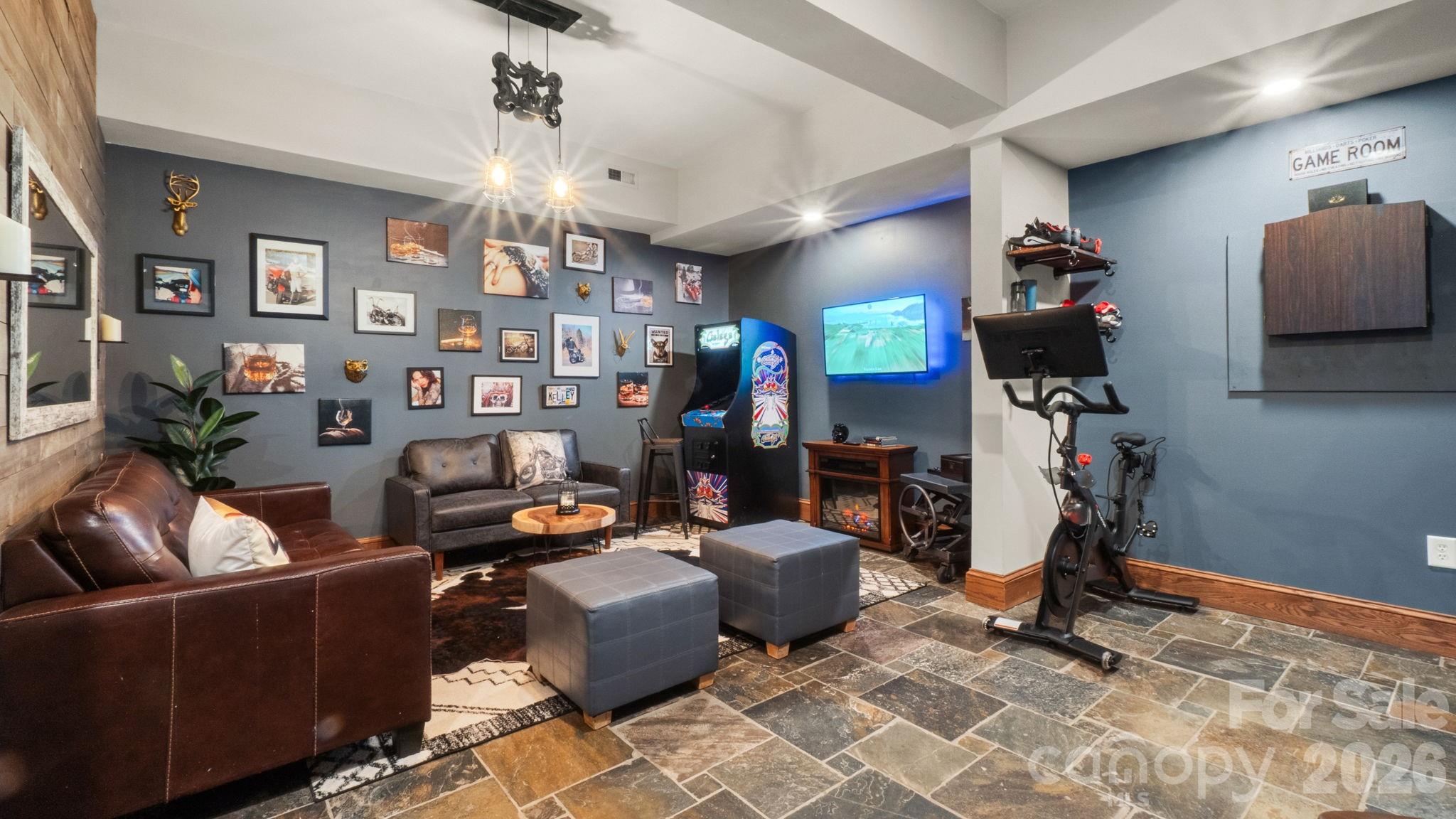 907 Derick's Crossing Fort Mill, SC 29708 - Photo 32 of 47 a living room with fireplace furniture and a chandelier