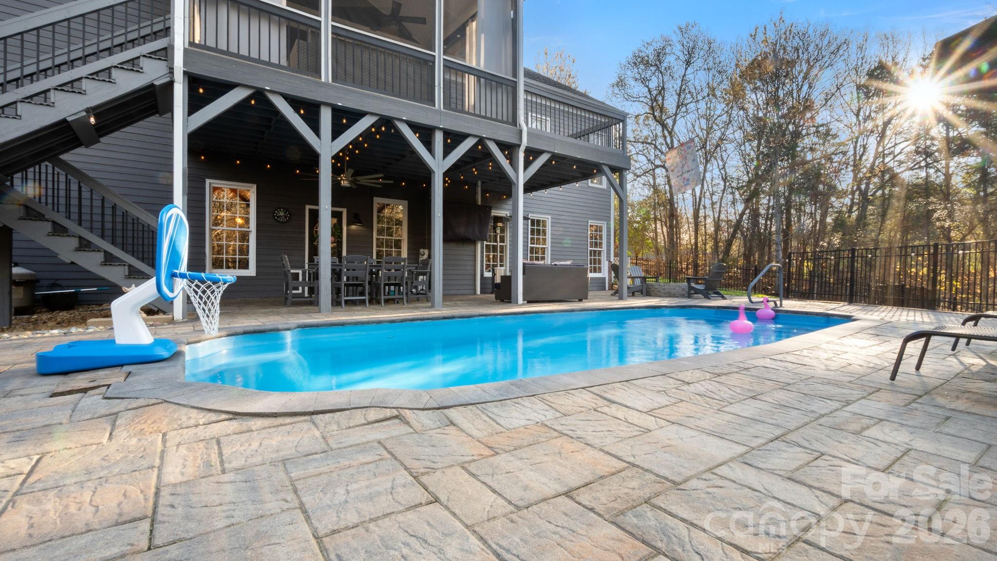 907 Derick's Crossing Fort Mill, SC 29708 - Photo 34 of 47 a view of house with swimming pool and sitting area