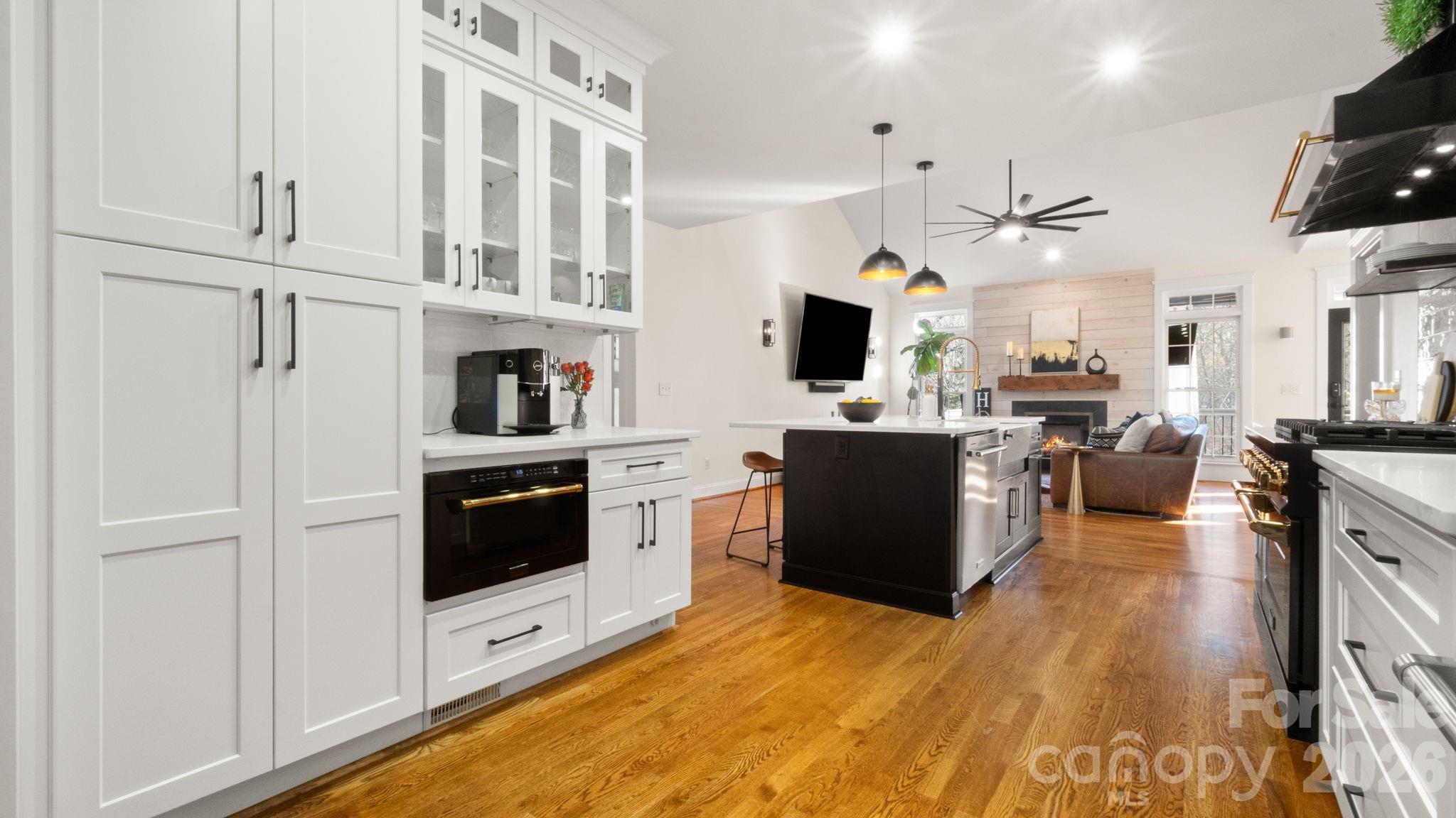907 Derick's Crossing Fort Mill, SC 29708 - Photo 7 of 47 a large white kitchen with stainless steel appliances
