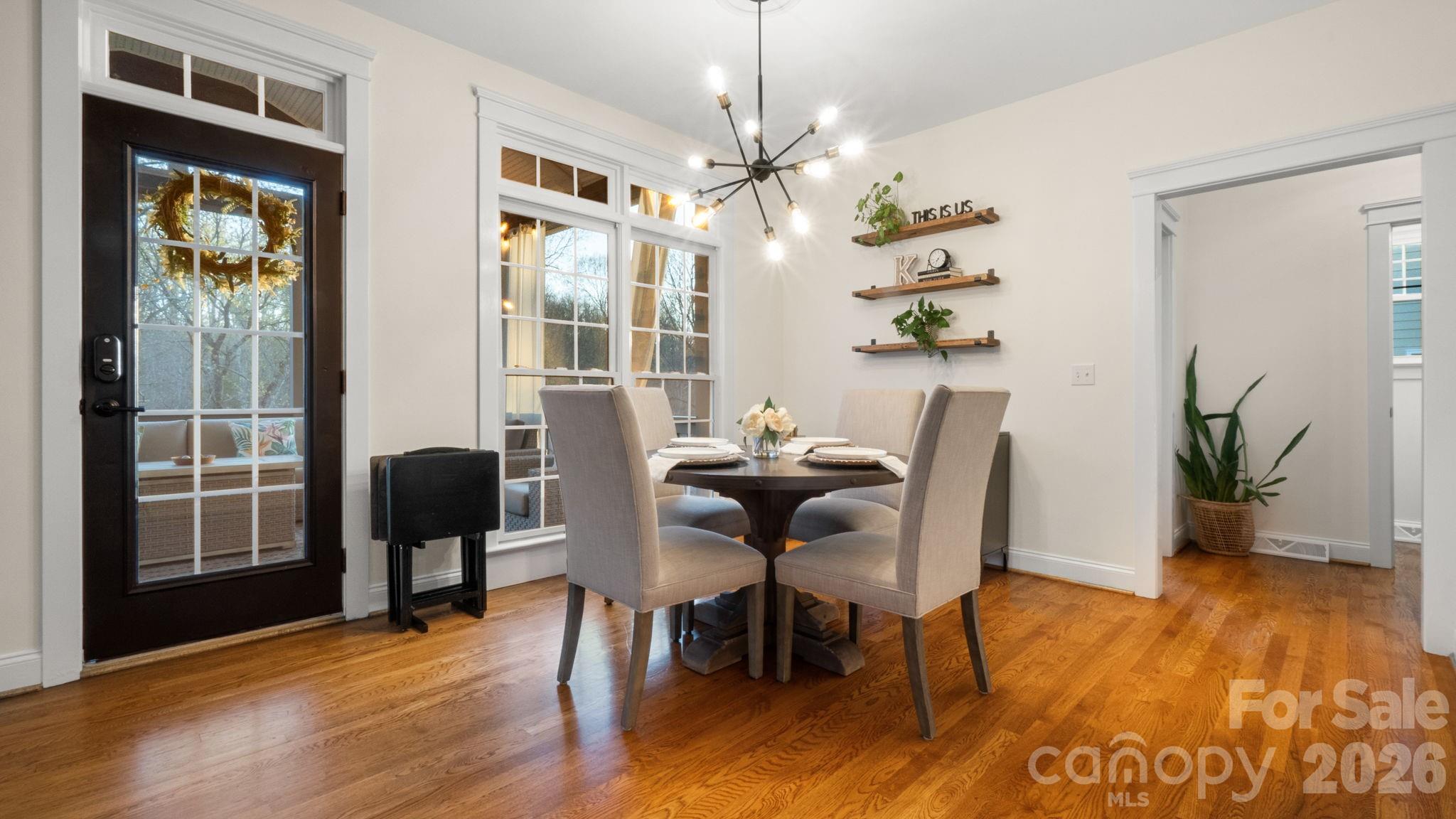 907 Derick's Crossing Fort Mill, SC 29708 - Photo 10 of 47 a view of a dining room with furniture window and wooden floor