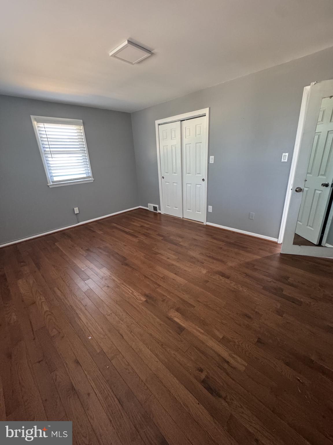 7410 Dickenson Street Springfield, VA 22150 - Photo 8 of 14 Bright and airy room with hardwood floors.