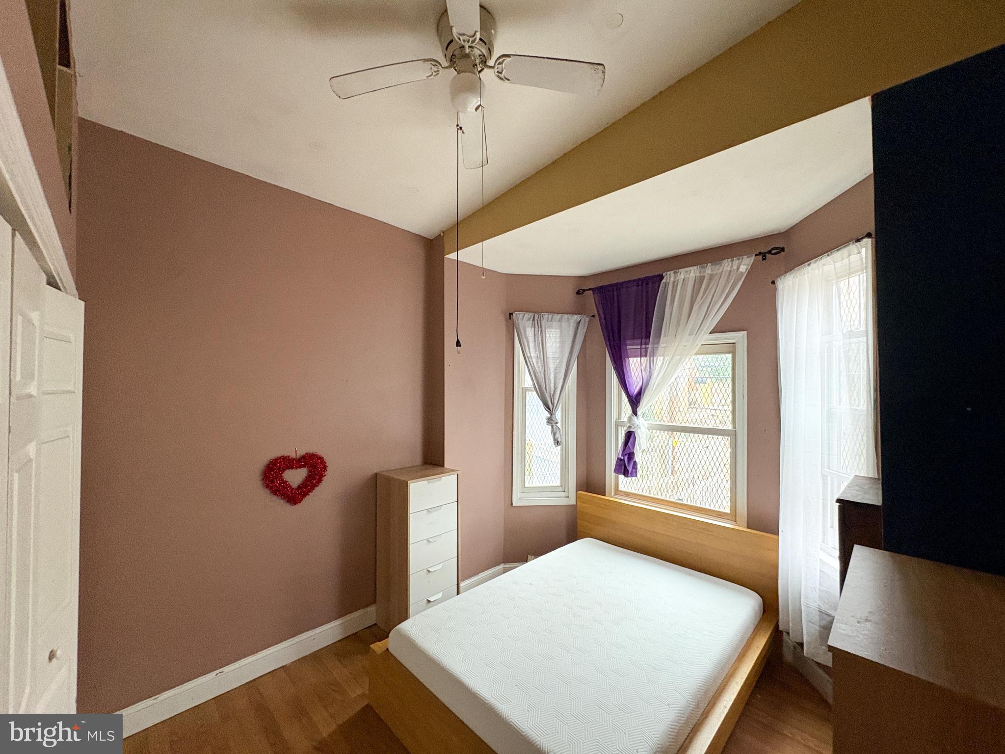 754 Dolphin Street Baltimore, MD 21217 - Photo 16 of 23 a bedroom with a bed and a window