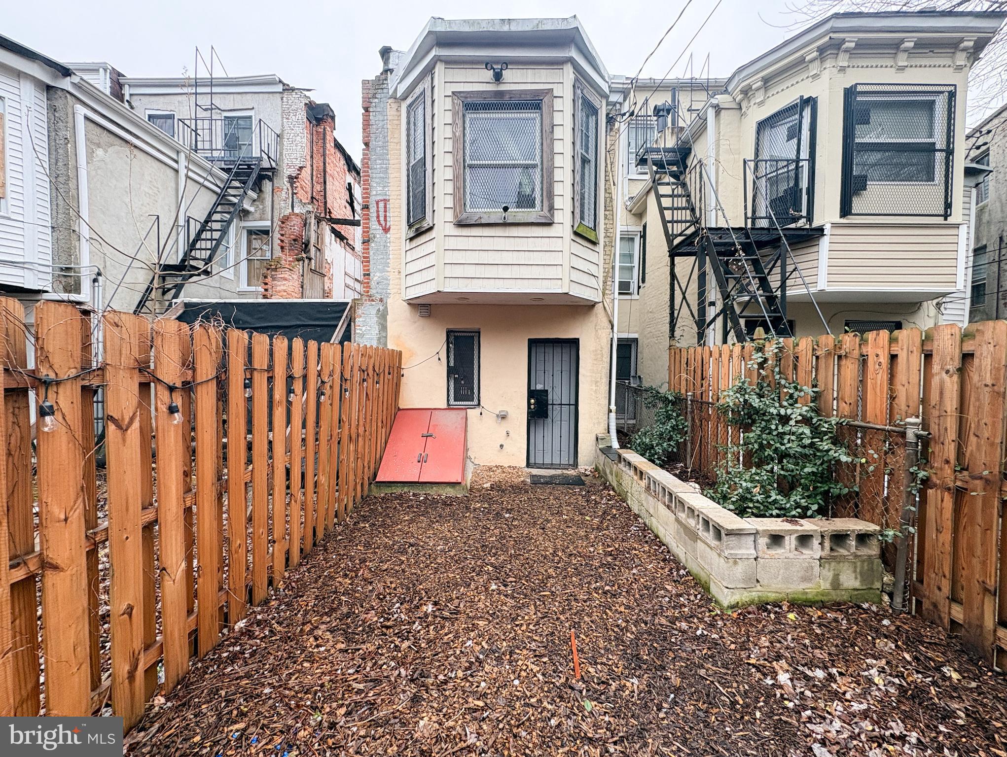 754 Dolphin Street Baltimore, MD 21217 - Photo 20 of 23 a front view of a house with a yard